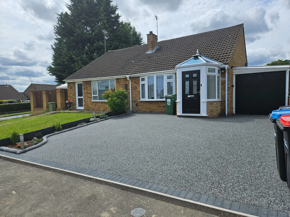 Grey resin driveway at a bungalow